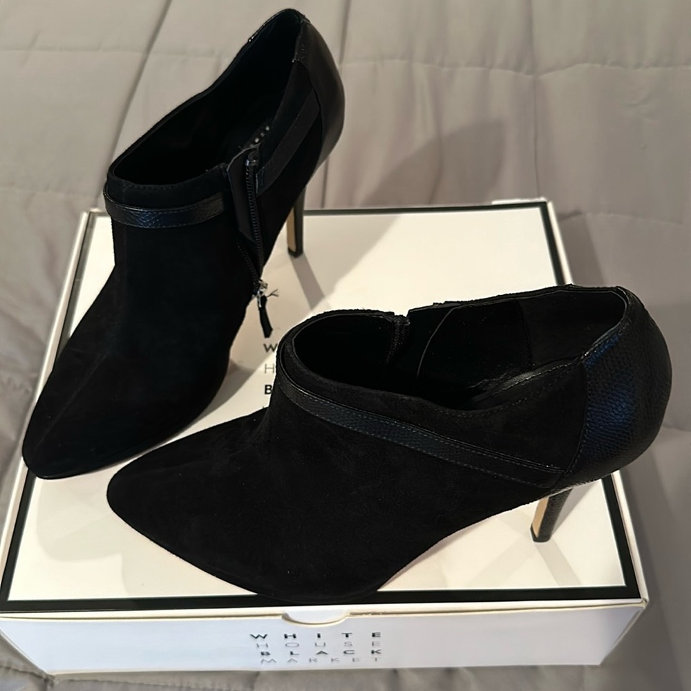 WHBM high heeled black suede booties.